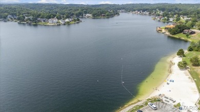 Lakefront Living at Its Finest! Nestled on a picturesque 1/2 on Raintree Country Club in Missouri - for sale on GolfHomes.com, golf home, golf lot