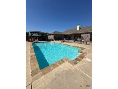This stunning 4 bedroom, 2 bath home with a sparkling pool is on Gatesville Country Club in Texas - for sale on GolfHomes.com, golf home, golf lot