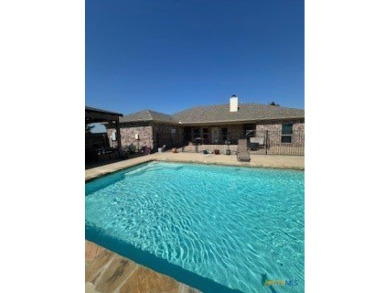 This stunning 4 bedroom, 2 bath home with a sparkling pool is on Gatesville Country Club in Texas - for sale on GolfHomes.com, golf home, golf lot