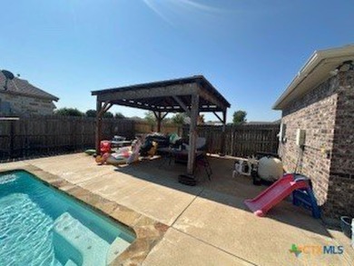 This stunning 4 bedroom, 2 bath home with a sparkling pool is on Gatesville Country Club in Texas - for sale on GolfHomes.com, golf home, golf lot
