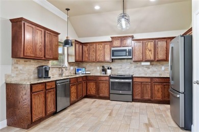 Experience luxury living on the 10th fairway of The Hideout Golf on Hideout Golf Club and Resort  in Texas - for sale on GolfHomes.com, golf home, golf lot