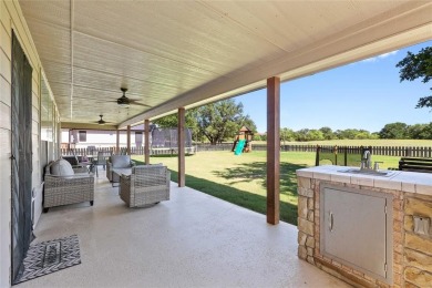 Experience luxury living on the 10th fairway of The Hideout Golf on Hideout Golf Club and Resort  in Texas - for sale on GolfHomes.com, golf home, golf lot