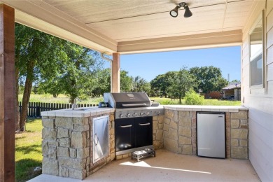 Experience luxury living on the 10th fairway of The Hideout Golf on Hideout Golf Club and Resort  in Texas - for sale on GolfHomes.com, golf home, golf lot