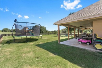 Experience luxury living on the 10th fairway of The Hideout Golf on Hideout Golf Club and Resort  in Texas - for sale on GolfHomes.com, golf home, golf lot