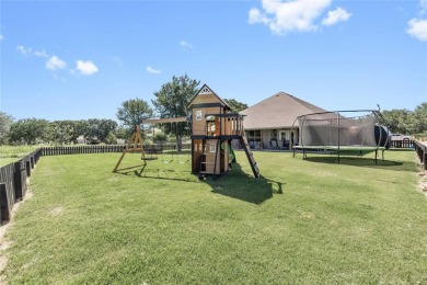 Experience luxury living on the 10th fairway of The Hideout Golf on Hideout Golf Club and Resort  in Texas - for sale on GolfHomes.com, golf home, golf lot