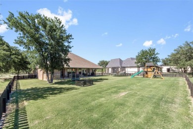 Experience luxury living on the 10th fairway of The Hideout Golf on Hideout Golf Club and Resort  in Texas - for sale on GolfHomes.com, golf home, golf lot
