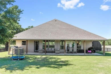 Experience luxury living on the 10th fairway of The Hideout Golf on Hideout Golf Club and Resort  in Texas - for sale on GolfHomes.com, golf home, golf lot