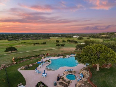 Experience luxury living on the 10th fairway of The Hideout Golf on Hideout Golf Club and Resort  in Texas - for sale on GolfHomes.com, golf home, golf lot