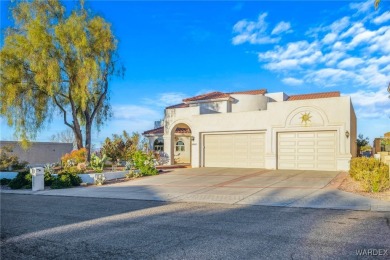 This home is on a quiet cul-de-sac at the edge of the Lake on London Bridge Golf Course in Arizona - for sale on GolfHomes.com, golf home, golf lot