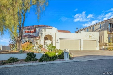 This home is on a quiet cul-de-sac at the edge of the Lake on London Bridge Golf Course in Arizona - for sale on GolfHomes.com, golf home, golf lot