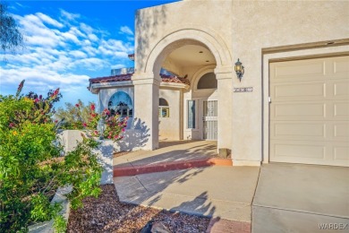 This home is on a quiet cul-de-sac at the edge of the Lake on London Bridge Golf Course in Arizona - for sale on GolfHomes.com, golf home, golf lot