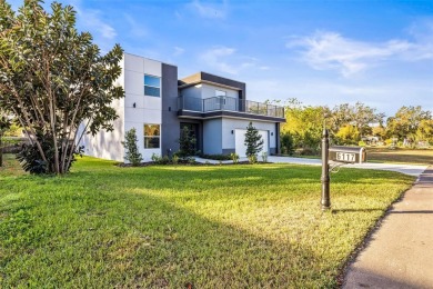 Welcome to this stunning 5-bedroom, 5.5-bathroom CONTEMPORARY on Temple Terrace Golf and Country Club in Florida - for sale on GolfHomes.com, golf home, golf lot