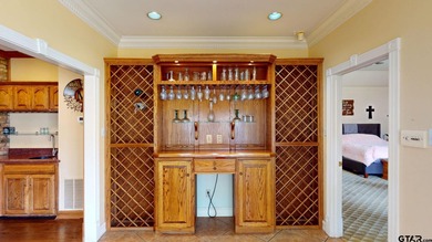 Welcome to Hollytree living in this  4BR/3BA estate spanning on Hollytree Country Club in Texas - for sale on GolfHomes.com, golf home, golf lot