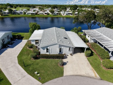 Enjoy stunning lakefront views from this beautiful TRIPLE-wide on Savanna Golf Club in Florida - for sale on GolfHomes.com, golf home, golf lot
