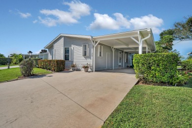 Enjoy stunning lakefront views from this beautiful TRIPLE-wide on Savanna Golf Club in Florida - for sale on GolfHomes.com, golf home, golf lot