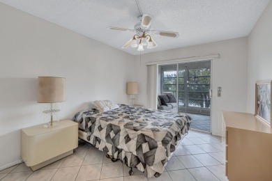 Spacious 2 bed, 2 bath condo in the popular Wynmoor community on Wynmoor Golf Course in Florida - for sale on GolfHomes.com, golf home, golf lot