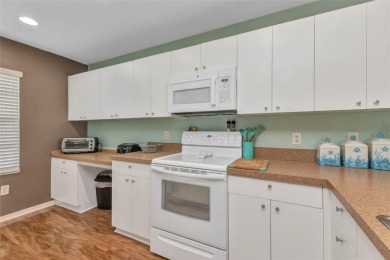 Discover this immaculate 2-bedroom, 2-bath condo with a den on Sabal Trace Golf and Country Club in Florida - for sale on GolfHomes.com, golf home, golf lot