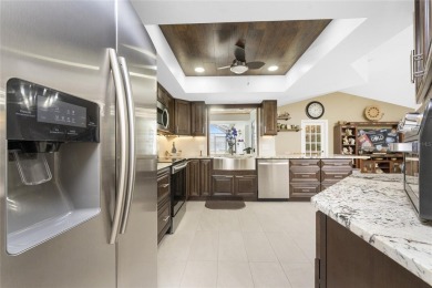 IMMACULATE  FULLY UPDATED, turnkey furnished, waterfront home on Pinemoor West Golf Club in Florida - for sale on GolfHomes.com, golf home, golf lot