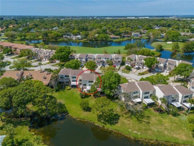 Under contract-accepting backup offers. Welcome to the top-rated on Feather Sound Country Club in Florida - for sale on GolfHomes.com, golf home, golf lot