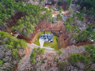 Welcome to this stunning and charming farmhouse-style, perfectly on River Golf and Country Club at Lake Royale in North Carolina - for sale on GolfHomes.com, golf home, golf lot
