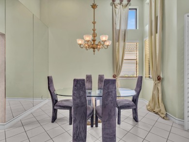 Step into this Stonebridge Country Club home with soaring on Stonebridge Golf and Country Club in Florida - for sale on GolfHomes.com, golf home, golf lot