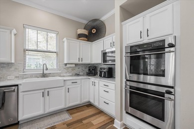 Stunning golf course home overlooking the 5th green of on Southwood Golf Club in Florida - for sale on GolfHomes.com, golf home, golf lot