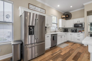 Stunning golf course home overlooking the 5th green of on Southwood Golf Club in Florida - for sale on GolfHomes.com, golf home, golf lot