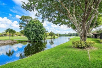 SPACIOUS WATERFRONT UNIT WITH NEW ROOF, GARAGE IN SOUGHT AFTER on Boca Lago Golf and Country Club in Florida - for sale on GolfHomes.com, golf home, golf lot