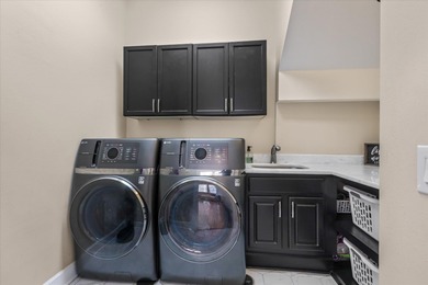 Stunning golf course home overlooking the 5th green of on Southwood Golf Club in Florida - for sale on GolfHomes.com, golf home, golf lot