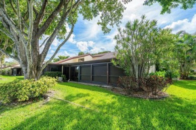 SPACIOUS WATERFRONT UNIT WITH NEW ROOF, GARAGE IN SOUGHT AFTER on Boca Lago Golf and Country Club in Florida - for sale on GolfHomes.com, golf home, golf lot