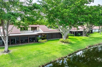 SPACIOUS WATERFRONT UNIT WITH NEW ROOF, GARAGE IN SOUGHT AFTER on Boca Lago Golf and Country Club in Florida - for sale on GolfHomes.com, golf home, golf lot