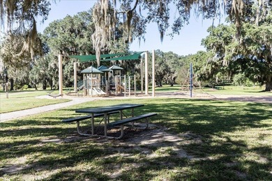 Stunning golf course home overlooking the 5th green of on Southwood Golf Club in Florida - for sale on GolfHomes.com, golf home, golf lot