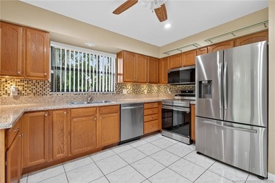 Welcome home to this beautifully updated single-story residence on Martin Downs Country Club in Florida - for sale on GolfHomes.com, golf home, golf lot