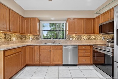 Welcome home to this beautifully updated single-story residence on Martin Downs Country Club in Florida - for sale on GolfHomes.com, golf home, golf lot