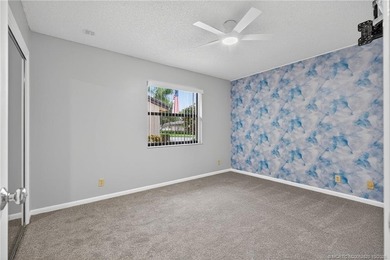 Welcome home to this beautifully updated single-story residence on Martin Downs Country Club in Florida - for sale on GolfHomes.com, golf home, golf lot