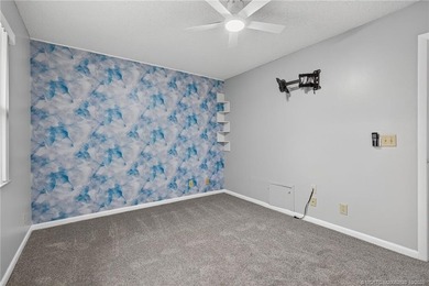 Welcome home to this beautifully updated single-story residence on Martin Downs Country Club in Florida - for sale on GolfHomes.com, golf home, golf lot