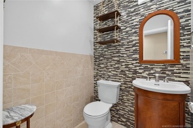 Welcome home to this beautifully updated single-story residence on Martin Downs Country Club in Florida - for sale on GolfHomes.com, golf home, golf lot