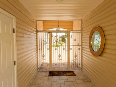 The perfect home for the RV community or convert the RV garage on The Great Outdoors Golf and Country Club in Florida - for sale on GolfHomes.com, golf home, golf lot