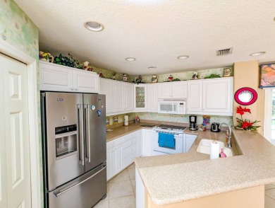 The perfect home for the RV community or convert the RV garage on The Great Outdoors Golf and Country Club in Florida - for sale on GolfHomes.com, golf home, golf lot
