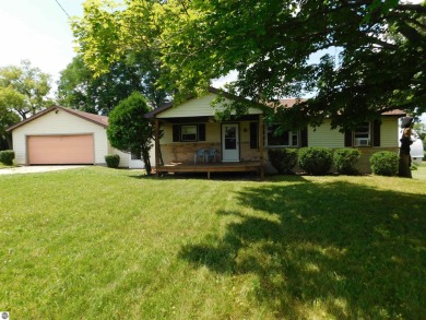 Discover your perfect retreat in the heart of northern Michigan! on Eagle Ridge Golf Course in Michigan - for sale on GolfHomes.com, golf home, golf lot