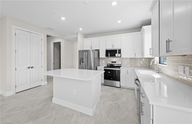 Enjoy low-maintenance, resort-style living in this beautifully on River Hall Country Club in Florida - for sale on GolfHomes.com, golf home, golf lot