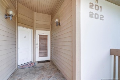 Enjoy breathtaking panoramic views of the golf course and lake on Ocean Club At the Hutchinson Island Beach Resort in Florida - for sale on GolfHomes.com, golf home, golf lot