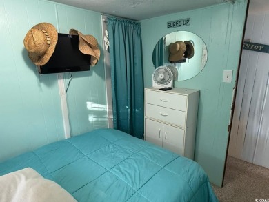 This cozy 2 bed, 1 bath furnished mobile home in the Waterway on Barefoot Resort and Golf Club  in South Carolina - for sale on GolfHomes.com, golf home, golf lot