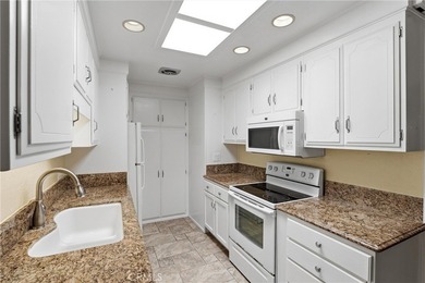 This light-filled Monterey model condo in Laguna Woods offers a on Leisure Village Par 3 Golf Course in California - for sale on GolfHomes.com, golf home, golf lot