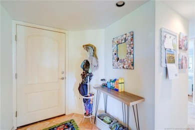 Enjoy breathtaking panoramic views of the golf course and lake on Ocean Club At the Hutchinson Island Beach Resort in Florida - for sale on GolfHomes.com, golf home, golf lot