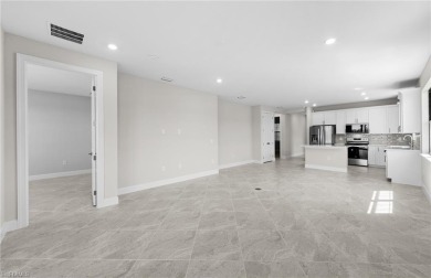 Enjoy low-maintenance, resort-style living in this beautifully on River Hall Country Club in Florida - for sale on GolfHomes.com, golf home, golf lot