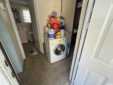 This cozy 2 bed, 1 bath furnished mobile home in the Waterway on Barefoot Resort and Golf Club  in South Carolina - for sale on GolfHomes.com, golf home, golf lot