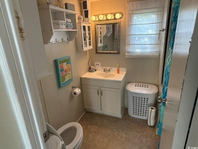 This cozy 2 bed, 1 bath furnished mobile home in the Waterway on Barefoot Resort and Golf Club  in South Carolina - for sale on GolfHomes.com, golf home, golf lot