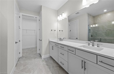 Enjoy low-maintenance, resort-style living in this beautifully on River Hall Country Club in Florida - for sale on GolfHomes.com, golf home, golf lot