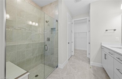 Enjoy low-maintenance, resort-style living in this beautifully on River Hall Country Club in Florida - for sale on GolfHomes.com, golf home, golf lot